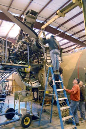 Greg, Jim and Lee reinstalling the prop on the C-123K Greg, Jim and Lee reinstalling the prop on the C-123K